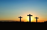 Three crosses on a hill, representing the crucifixion of Jesus with the two criminals crucified by His side.
